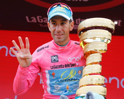 Italy's Vincenzo Nibali poses with the trophy after winning the 99th Giro d'Italia, Tour of Italy, after the 21th stage from Cuneo to Turin on May 29, 2016. Astana's Vincenzo Nibali secured his second Giro d'Italia triumph on Sunday after topping a dramatic 99th edition that saw key rival Steven Kruijswijk agonisingly crash during the final stages. Germany's Nikias Arndt, of the Giant team, celebrated winning the final stage into Turin although it came only after Giacomo Nizzolo, of the Trek team, was stripped of the victory by race judges who ruled the Italian had hampered other riders by deviating from his sprint line.  / AFP / Luk BENIES        (Photo credit should read LUK BENIES/AFP/Getty Images)